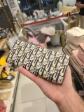 Portefeuille compact motif imprimé monogramme