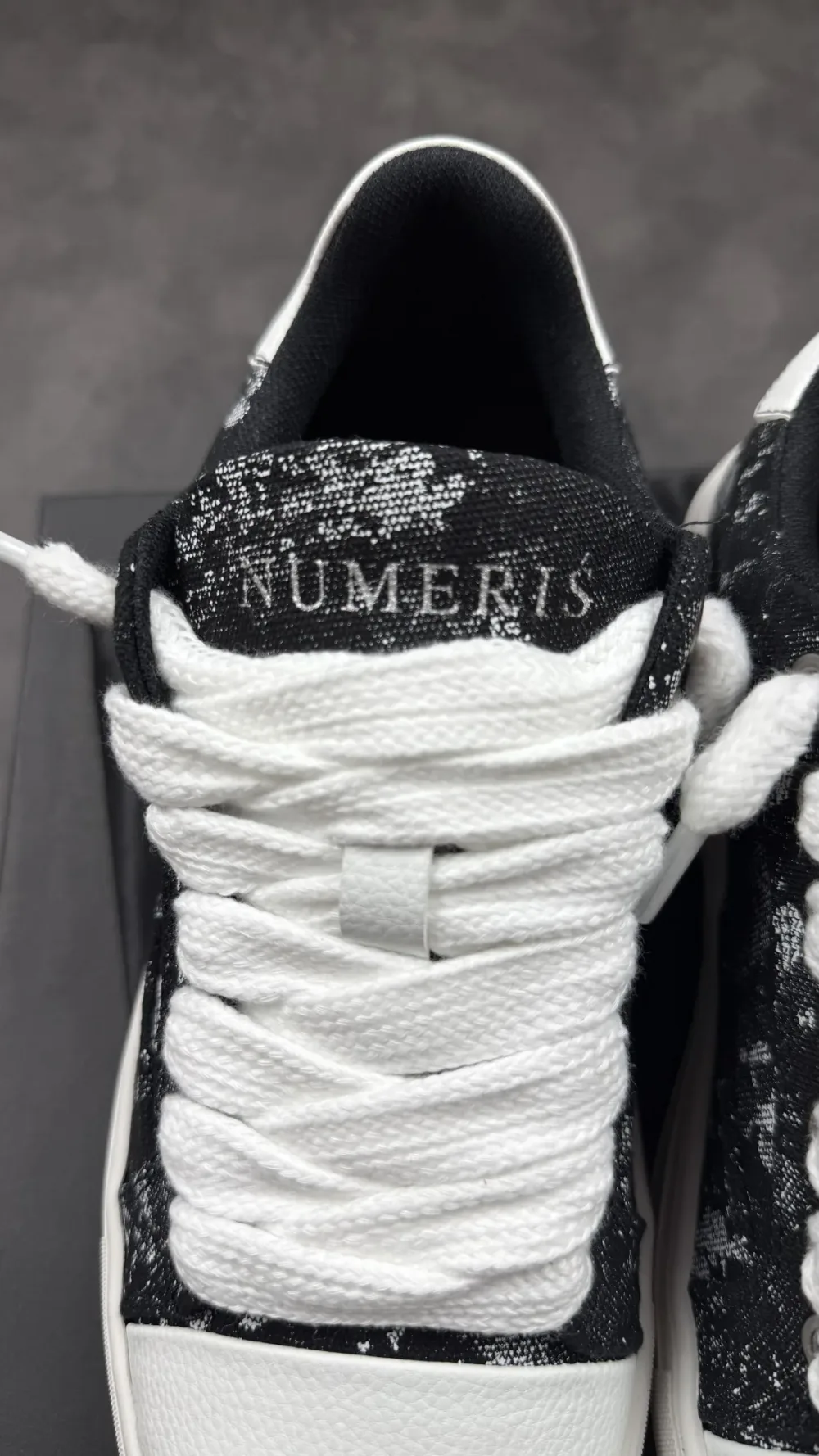 Numeris black Tache