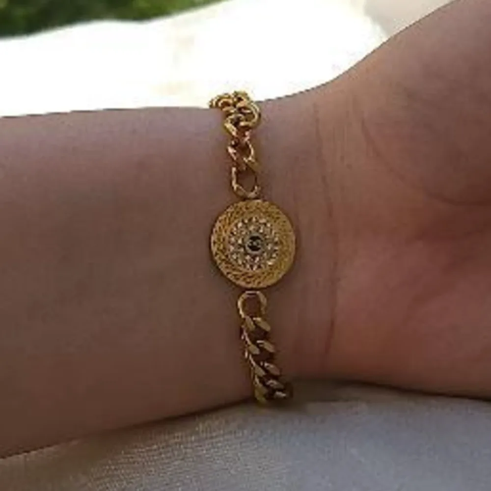 Bracelet gourmette à médaillon rond