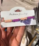 Bracelet perles heishi avec pompon — "Fashion Jewelry"