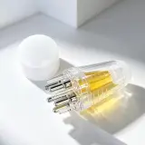 Applicateur de huile pour cheveux