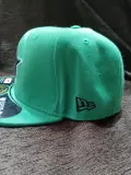 flat green cap
