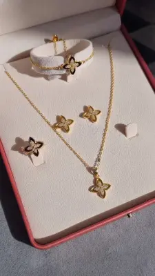 طقم الزهرة الذهبية الأنيق             Parure Élégance Fleur Dorée