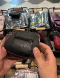 Porte-monnaie en cuir véritable, fermoir clic-clac et poche zippée